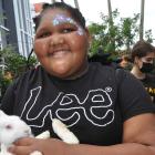 Isabelle, a client of the Lighthouse of Broward holds a bunny